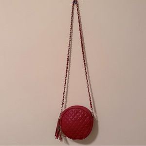 Round red crossbody bag